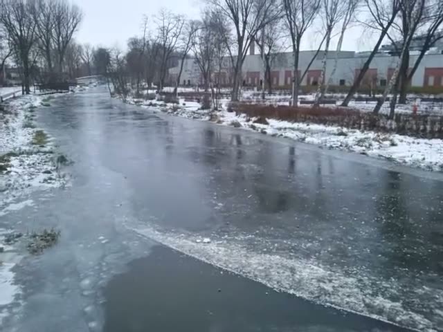 The Wolbórka River is ice bound. View from the bridge on the linking W
